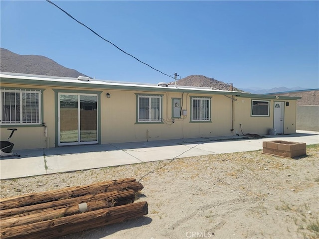 15845 La Vida Dr, Palm Springs, CA 92262 - rear view of house featuring a mountain view and a patio area