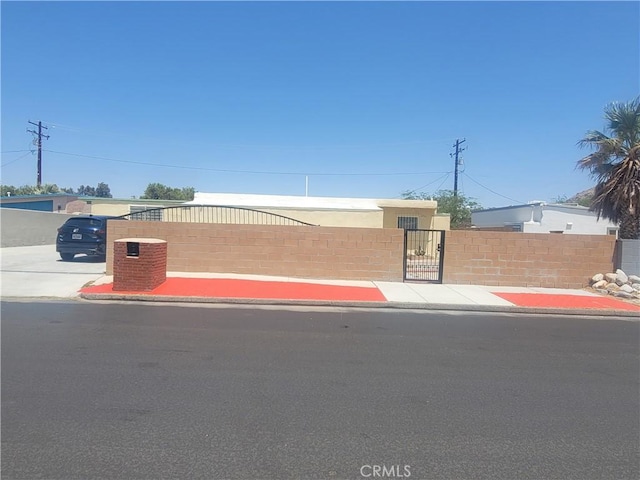 15845 La Vida Dr, Palm Springs, CA 92262 - view of front of property with a gate