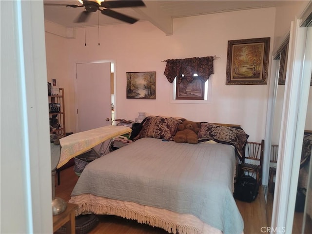 15845 La Vida Dr, Palm Springs, CA 92262 - bedroom with wood finished floors, beam ceiling, and ceiling fan