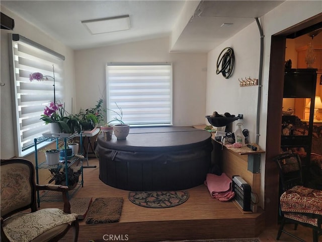 15845 La Vida Dr, Palm Springs, CA 92262 - interior space with wood finished floors and vaulted ceiling