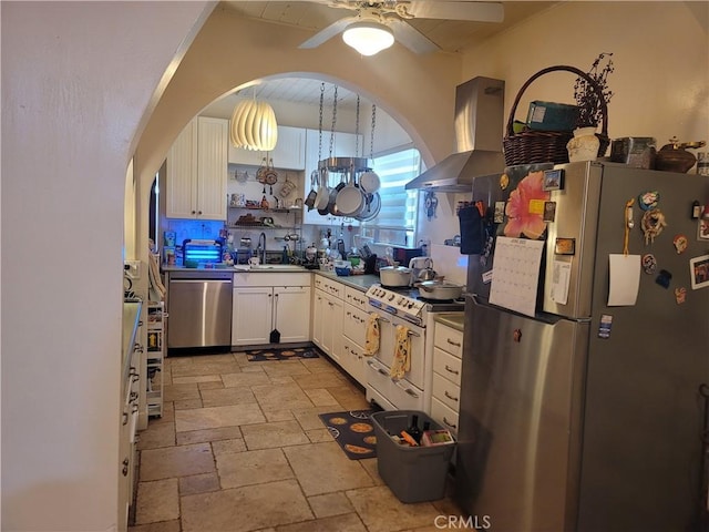 15845 La Vida Dr, Palm Springs, CA 92262 - kitchen featuring stainless steel appliances, extractor fan, stone tile floors, open shelves, and white cabinetry