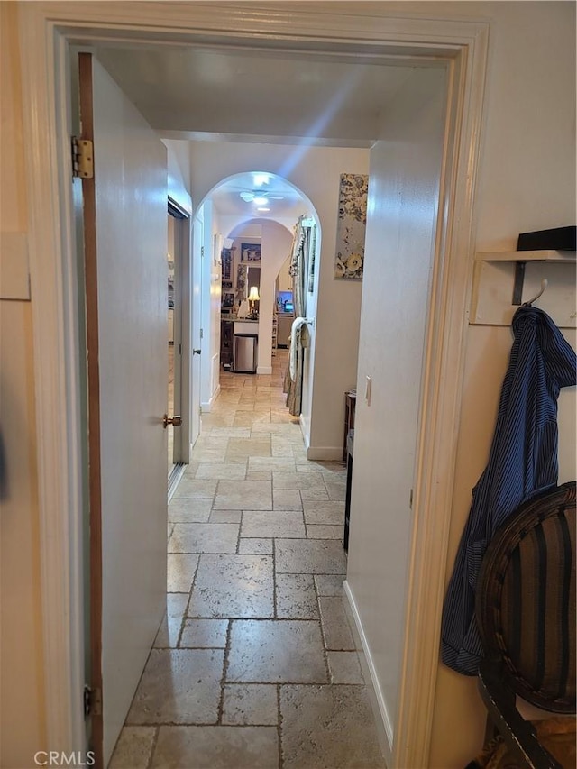 15845 La Vida Dr, Palm Springs, CA 92262 - corridor featuring stone tile floors and arched walkways