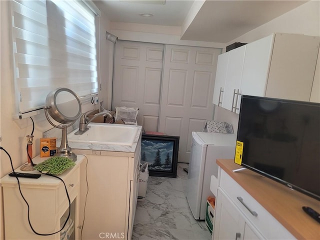 15845 La Vida Dr, Palm Springs, CA 92262 - washroom with light marble finish floors and cabinet space