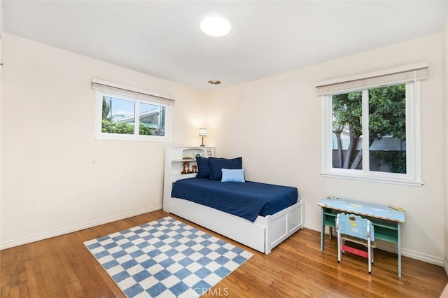 21225 Kent Ave, Torrance, CA 90503 - bedroom with light wood finished floors and multiple windows