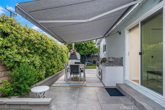 21225 Kent Ave, Torrance, CA 90503 - view of patio / terrace featuring outdoor dining space and an outdoor kitchen