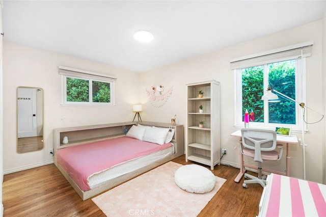 21225 Kent Ave, Torrance, CA 90503 - bedroom featuring wood finished floors and multiple windows