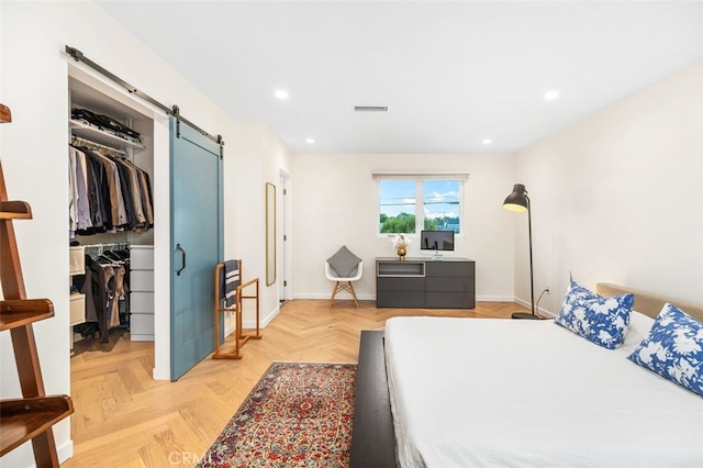 21225 Kent Ave, Torrance, CA 90503 - bedroom featuring a barn door, a spacious closet, recessed lighting, and a closet
