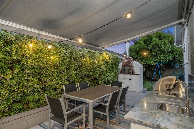 21225 Kent Ave, Torrance, CA 90503 - view of patio / terrace with a fireplace, area for grilling, and outdoor dining space