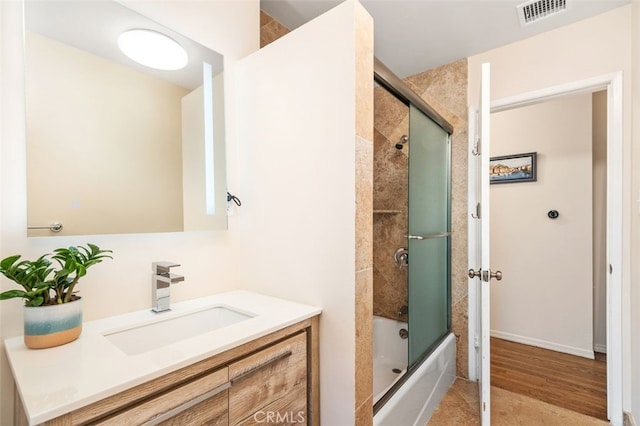 21225 Kent Ave, Torrance, CA 90503 - bathroom featuring vanity, shower / bath combination with glass door, and wood finished floors
