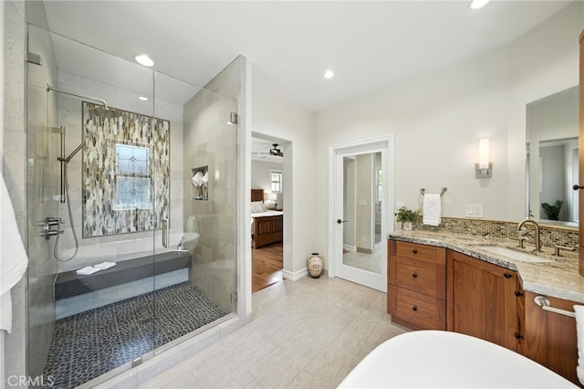 72 Shade Tree, Irvine, CA 92603 - full bathroom featuring vanity, a stall shower, recessed lighting, a freestanding bath, and decorative backsplash
