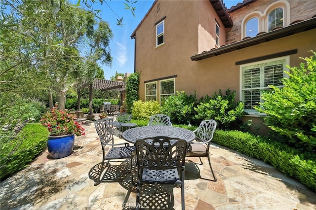 72 Shade Tree, Irvine, CA 92603 - view of patio featuring outdoor dining space and a pergola