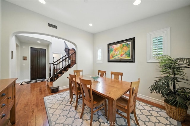 72 Shade Tree, Irvine, CA 92603 - dining room with stairway, arched walkways, light wood-type flooring, recessed lighting, and healthy amount of natural light