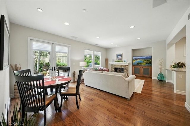 72 Shade Tree, Irvine, CA 92603 - dining area featuring hardwood / wood-style floors, a fireplace, and recessed lighting