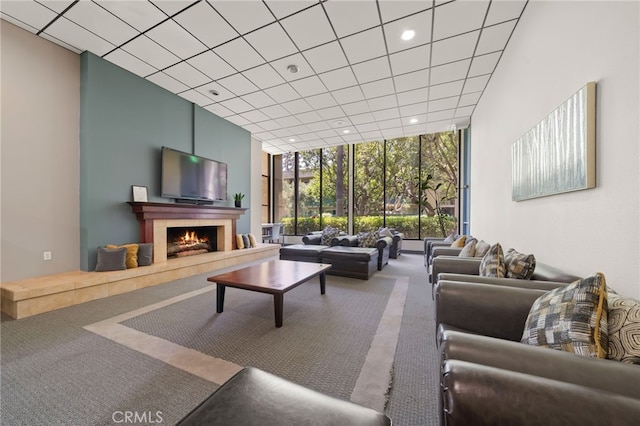 564 N Bellflower Blvd Unit 105, Long Beach, CA 90814 - carpeted living area featuring expansive windows, a fireplace, and recessed lighting