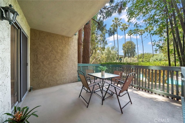 564 N Bellflower Blvd Unit 105, Long Beach, CA 90814 - balcony featuring outdoor dining area