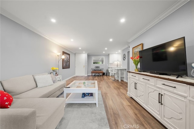 564 N Bellflower Blvd Unit 105, Long Beach, CA 90814 - living room featuring crown molding, light wood-style floors, and recessed lighting