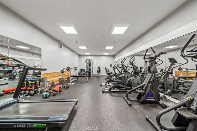 564 N Bellflower Blvd Unit 105, Long Beach, CA 90814 - exercise room featuring a textured ceiling