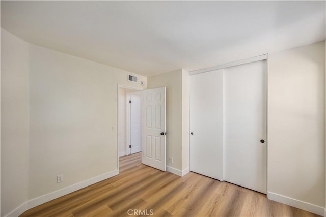 11142 Malone St, Rancho Cucamonga, CA 91701 - unfurnished bedroom featuring light wood-style floors and a closet