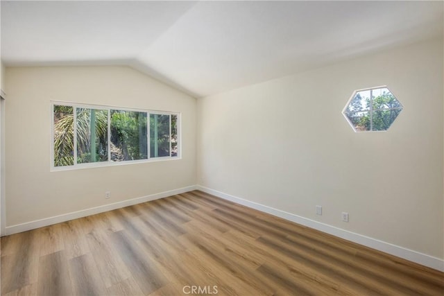 11142 Malone St, Rancho Cucamonga, CA 91701 - spare room with healthy amount of natural light, lofted ceiling, and light wood-type flooring