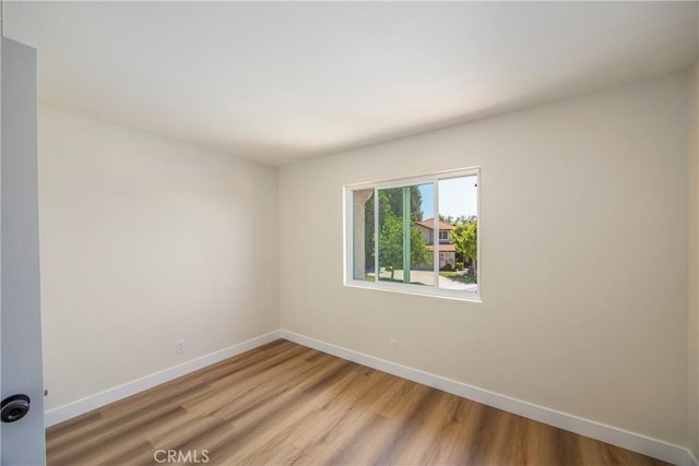 11142 Malone St, Rancho Cucamonga, CA 91701 - empty room featuring baseboards and light wood-style flooring