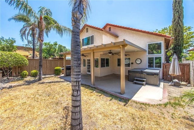 11142 Malone St, Rancho Cucamonga, CA 91701 - back of property with a hot tub, ceiling fan, stucco siding, a fenced backyard, and a patio