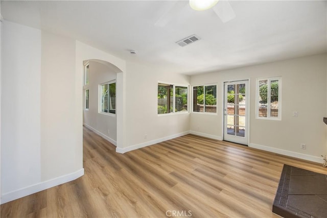 11142 Malone St, Rancho Cucamonga, CA 91701 - spare room with plenty of natural light, arched walkways, and light wood finished floors