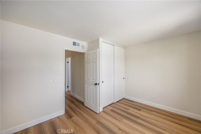 11142 Malone St, Rancho Cucamonga, CA 91701 - unfurnished bedroom with light wood-type flooring and a closet