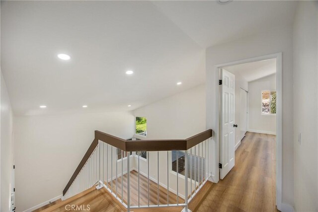 11142 Malone St, Rancho Cucamonga, CA 91701 - staircase featuring lofted ceiling, wood finished floors, and recessed lighting