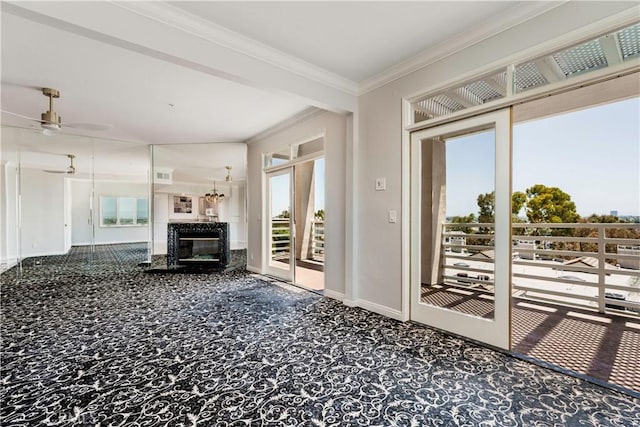 2604 E 20th St Unit 304, Signal Hill, CA 90755 - unfurnished living room with crown molding, ceiling fan, a fireplace, and carpet flooring