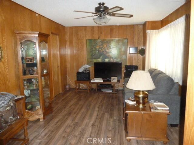 15411 Runnymede St, Van Nuys, CA 91406 - living area with a ceiling fan, wood walls, and wood finished floors