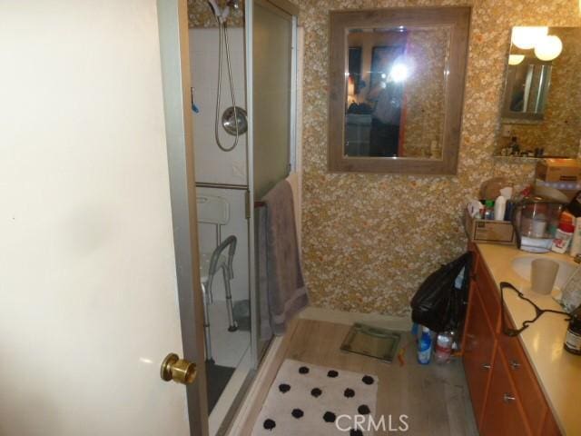 15411 Runnymede St, Van Nuys, CA 91406 - bathroom featuring a stall shower, vanity, and wood finished floors