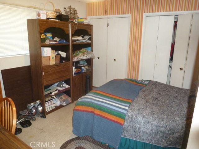 15411 Runnymede St, Van Nuys, CA 91406 - carpeted bedroom featuring multiple closets