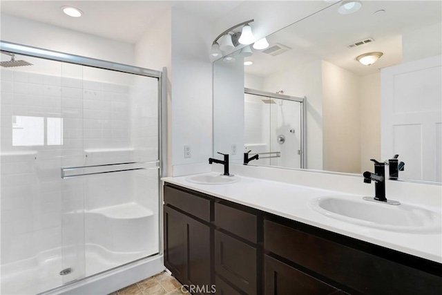 13219 Shaw Ln, Sylmar, CA 91342 - full bath featuring a shower stall, double vanity, and recessed lighting
