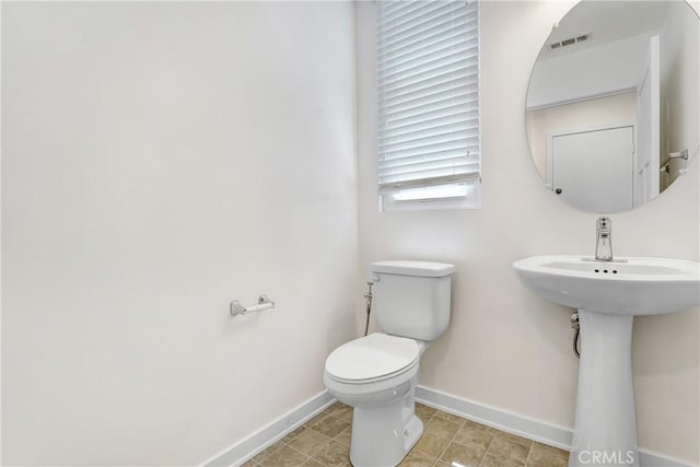 13219 Shaw Ln, Sylmar, CA 91342 - bathroom featuring baseboards and toilet