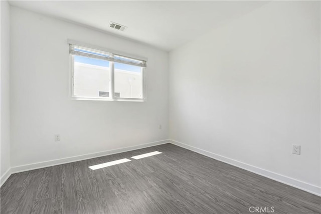 13219 Shaw Ln, Sylmar, CA 91342 - empty room with dark wood finished floors and baseboards