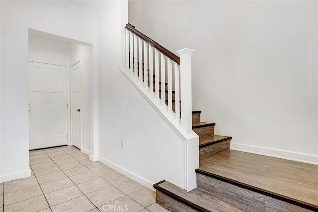 13219 Shaw Ln, Sylmar, CA 91342 - stairs featuring baseboards and tile patterned flooring