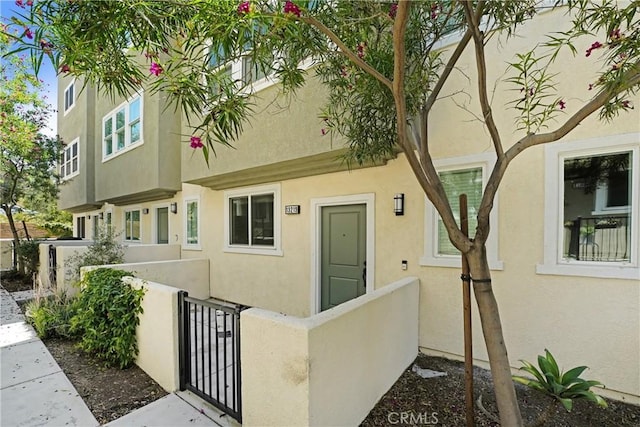 13219 Shaw Ln, Sylmar, CA 91342 - property entrance featuring stucco siding and a gate