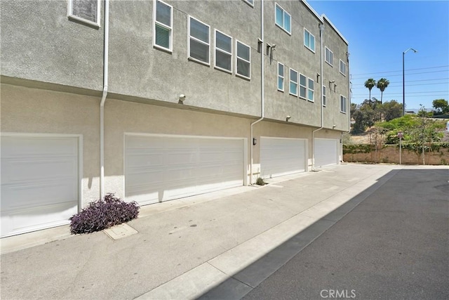 13219 Shaw Ln, Sylmar, CA 91342 - view of building exterior with a garage