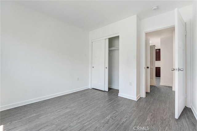 13219 Shaw Ln, Sylmar, CA 91342 - unfurnished bedroom with dark wood-style flooring and a closet