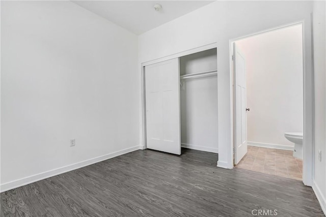 13219 Shaw Ln, Sylmar, CA 91342 - unfurnished bedroom with wood finished floors and a closet