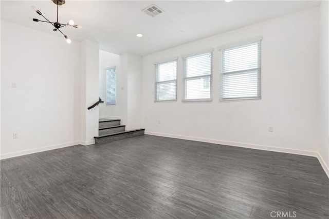 13219 Shaw Ln, Sylmar, CA 91342 - unfurnished room featuring dark wood-style flooring, a chandelier, stairs, and recessed lighting
