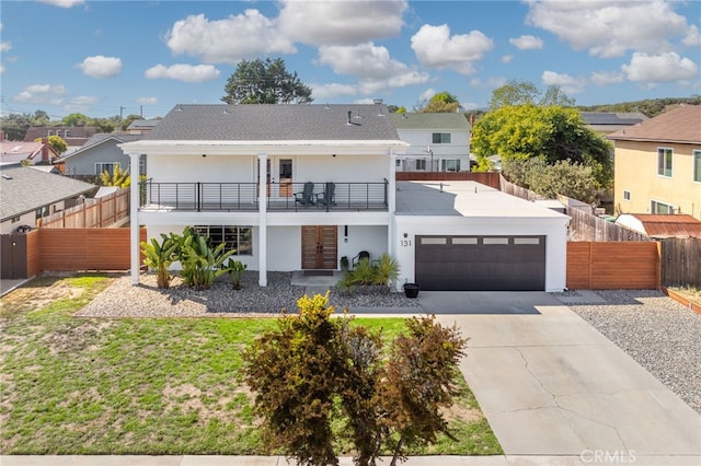 131 Gemini St, Lompoc, CA 93436 - view of front facade with french doors, a garage, concrete driveway, stucco siding, and a residential view