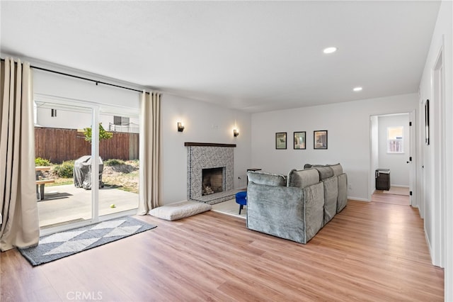 131 Gemini St, Lompoc, CA 93436 - living area featuring light wood finished floors, a fireplace with raised hearth, and recessed lighting