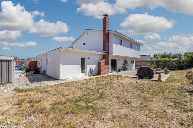 131 Gemini St, Lompoc, CA 93436 - rear view of property with a patio, stucco siding, and a chimney
