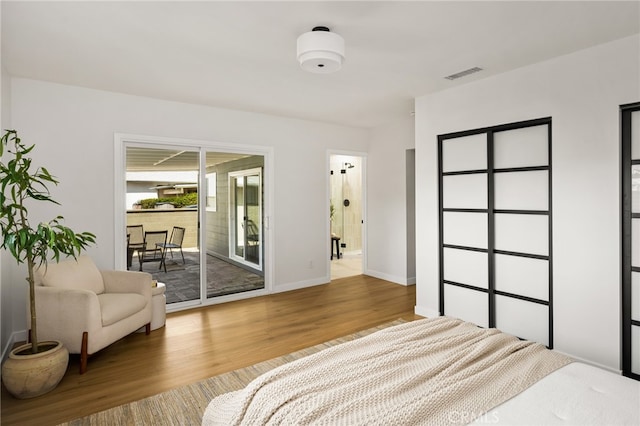 17216 Lorne St, Van Nuys, CA 91406 - bedroom featuring access to outside and wood finished floors
