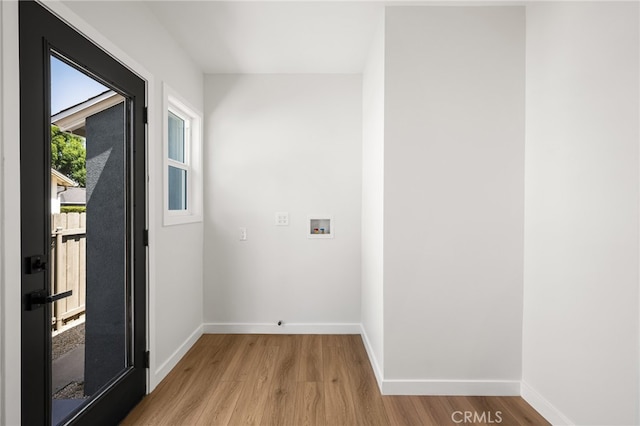 17216 Lorne St, Van Nuys, CA 91406 - laundry area featuring light wood finished floors and washer hookup