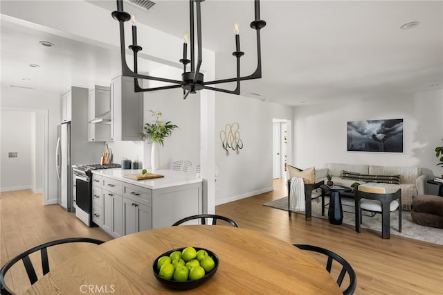 17216 Lorne St, Van Nuys, CA 91406 - dining room with light wood-style flooring and baseboards