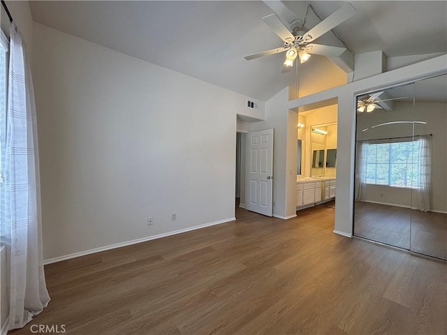 28741 La Triana, Laguna Niguel, CA 92677 - unfurnished bedroom featuring vaulted ceiling, wood finished floors, ensuite bath, ceiling fan, and a closet