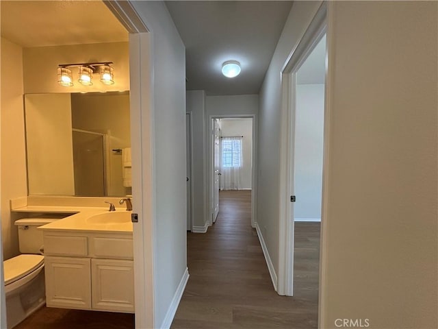28741 La Triana, Laguna Niguel, CA 92677 - hall with a sink and dark wood-type flooring