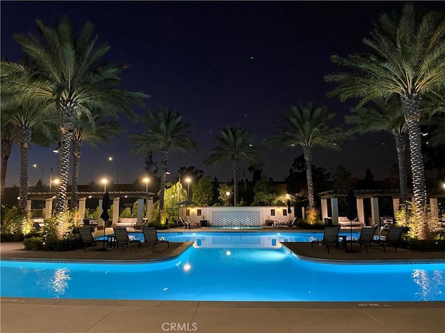 227 Carlow, Irvine, CA 92618 - pool at twilight featuring a community pool and a patio